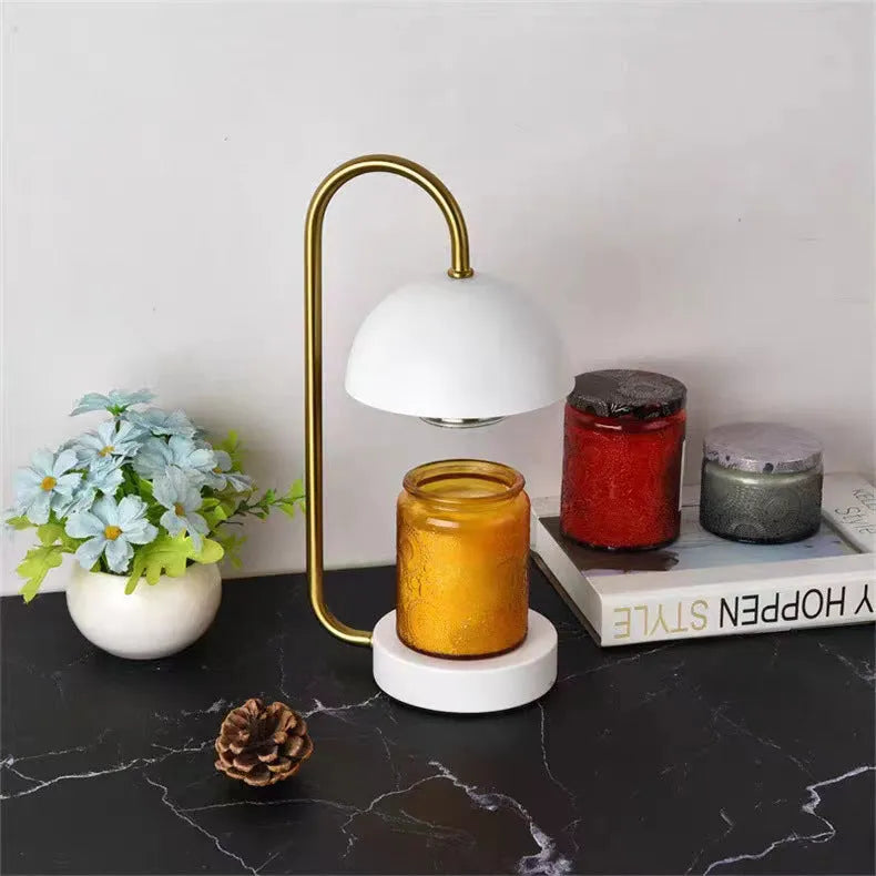 Solid wood base aromatherapy lamp with metal shade on a bedside table, with a wax melt dish.