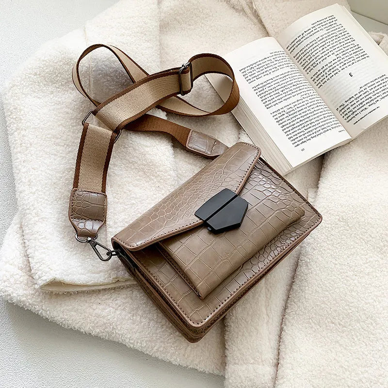 Vintage-style black PU leather crossbody bag with dimensions 20cm by 14cm by 7cm.