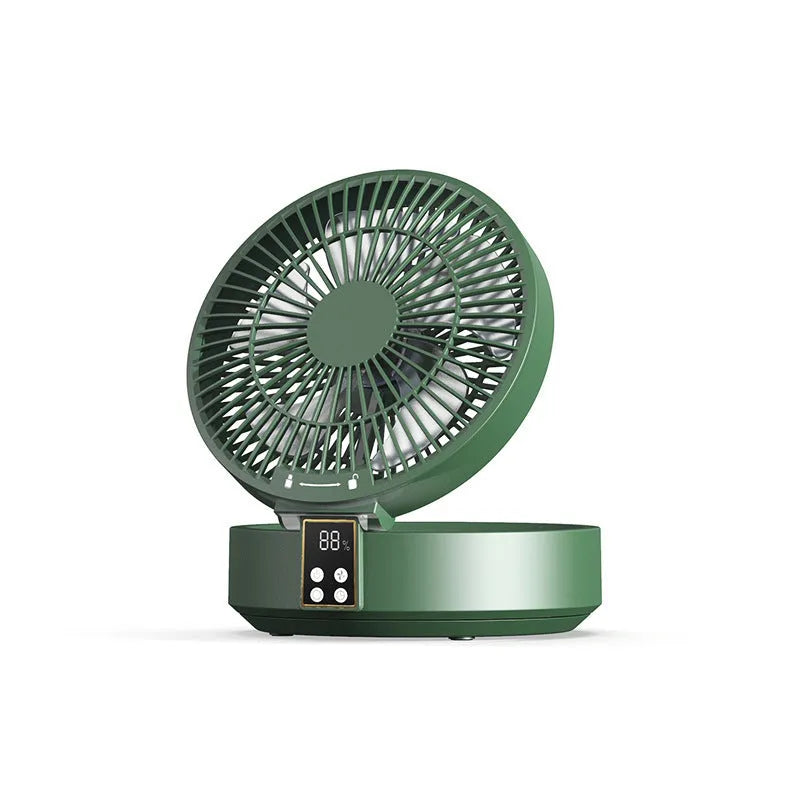 White portable USB rechargeable folding desk fan with remote control on wooden surface