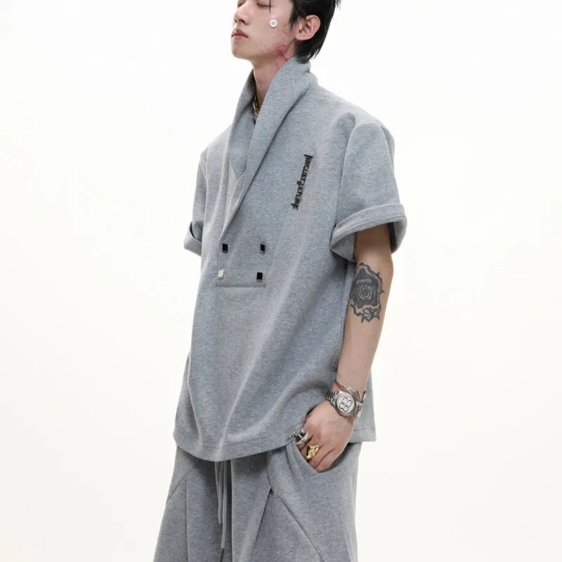 Men's dark grey cotton V-neck sports suit with padded shoulder short sleeve jacket and matching shorts.