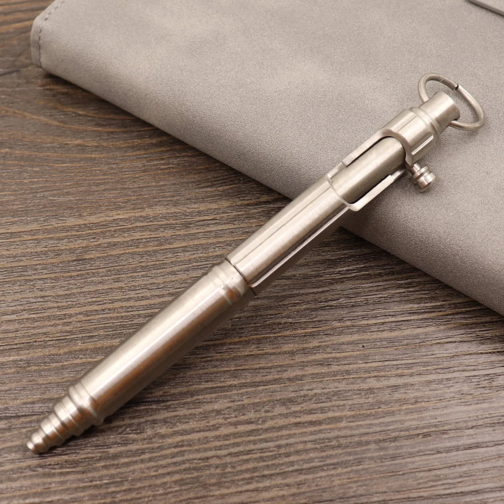 Brass tactical pen with bolt-action mechanism and retro brushed finish