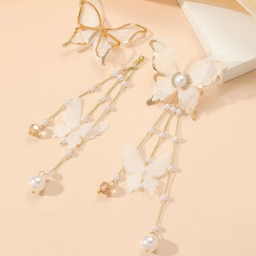 White butterfly earrings with lace patterns, rhinestones, pearls and tassel drops