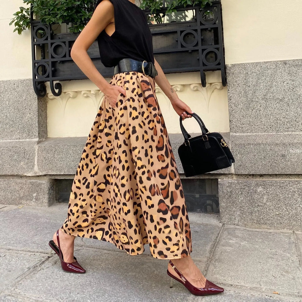 Brown leopard print women's A-line long skirt with big hem design shown in socialite styling