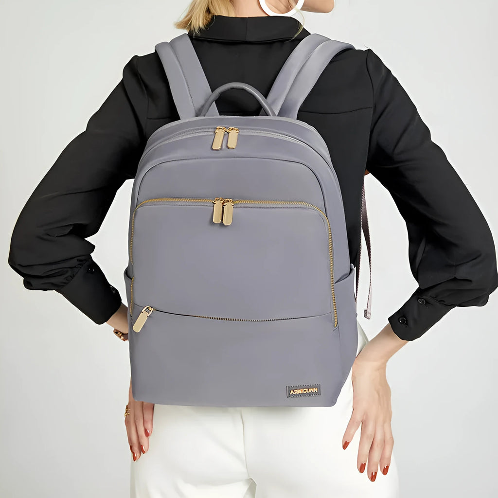 Oxford cloth women's backpack in black and purplish grey, showing large capacity and shoulder straps.