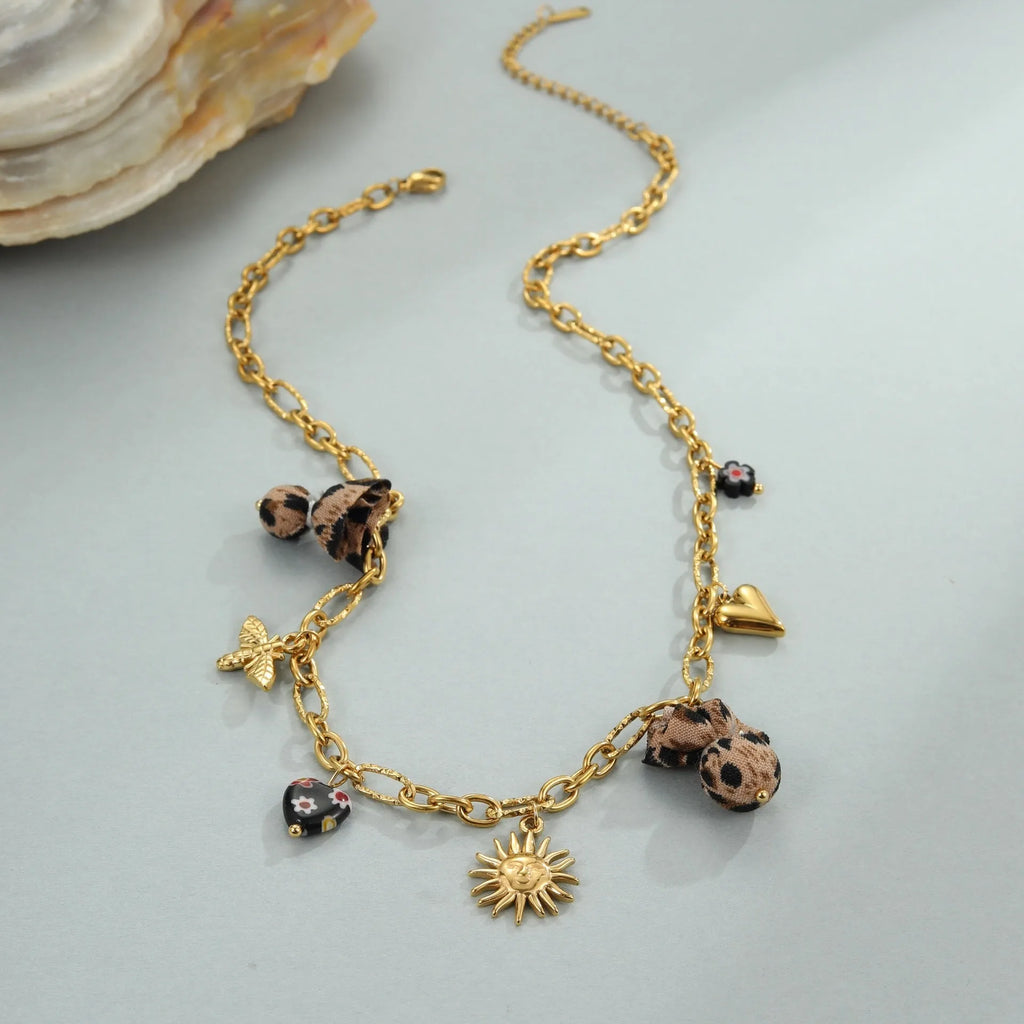 Women's stainless steel leopard pendant necklace with love heart and flower details on 41-50cm adjustable chain