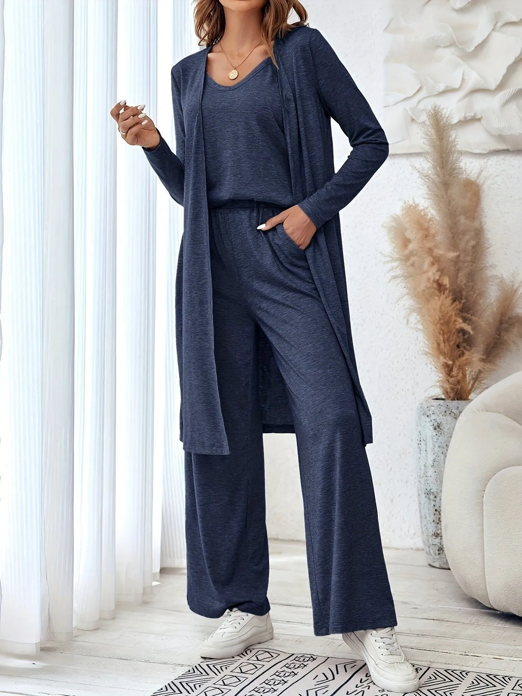 Blue polyester women's three-piece casual suit set with sling top, cardigan, trousers, and suspenders