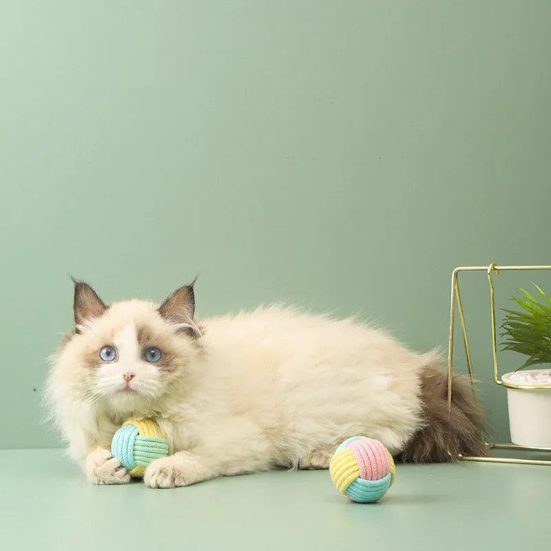 Handmade 5cm plush cotton ball cat toy in multiple colours for teeth grinding and interactive play