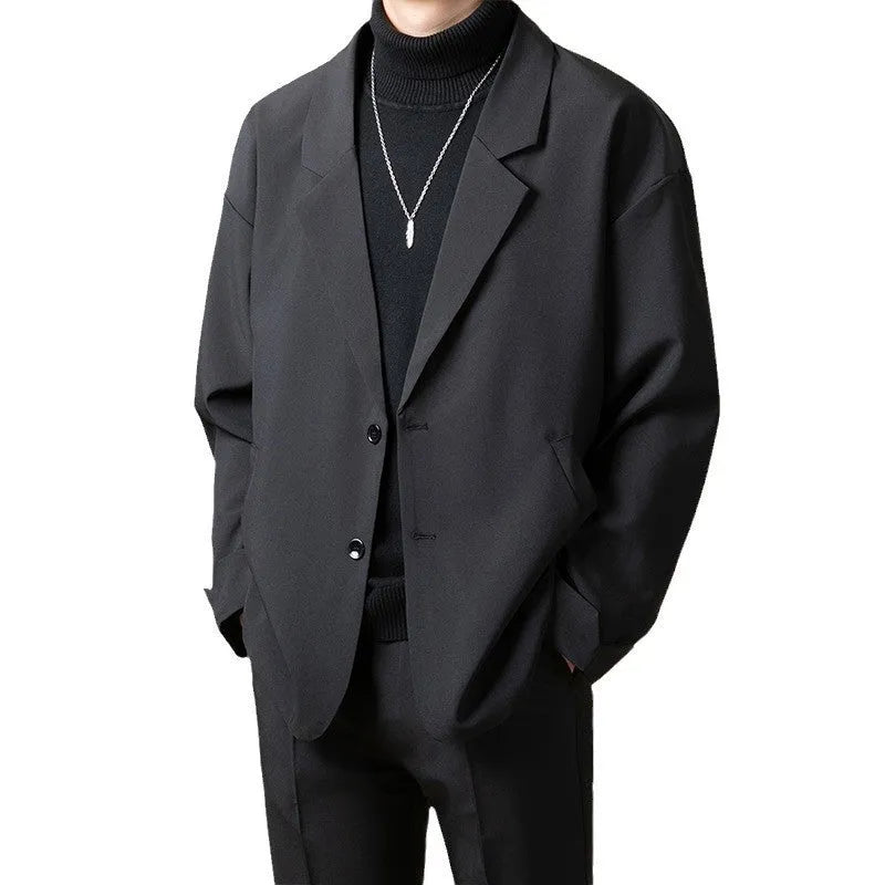 A man's loose-fit casual suit jacket in a polyester blend fabric, shown in one of four available colours.