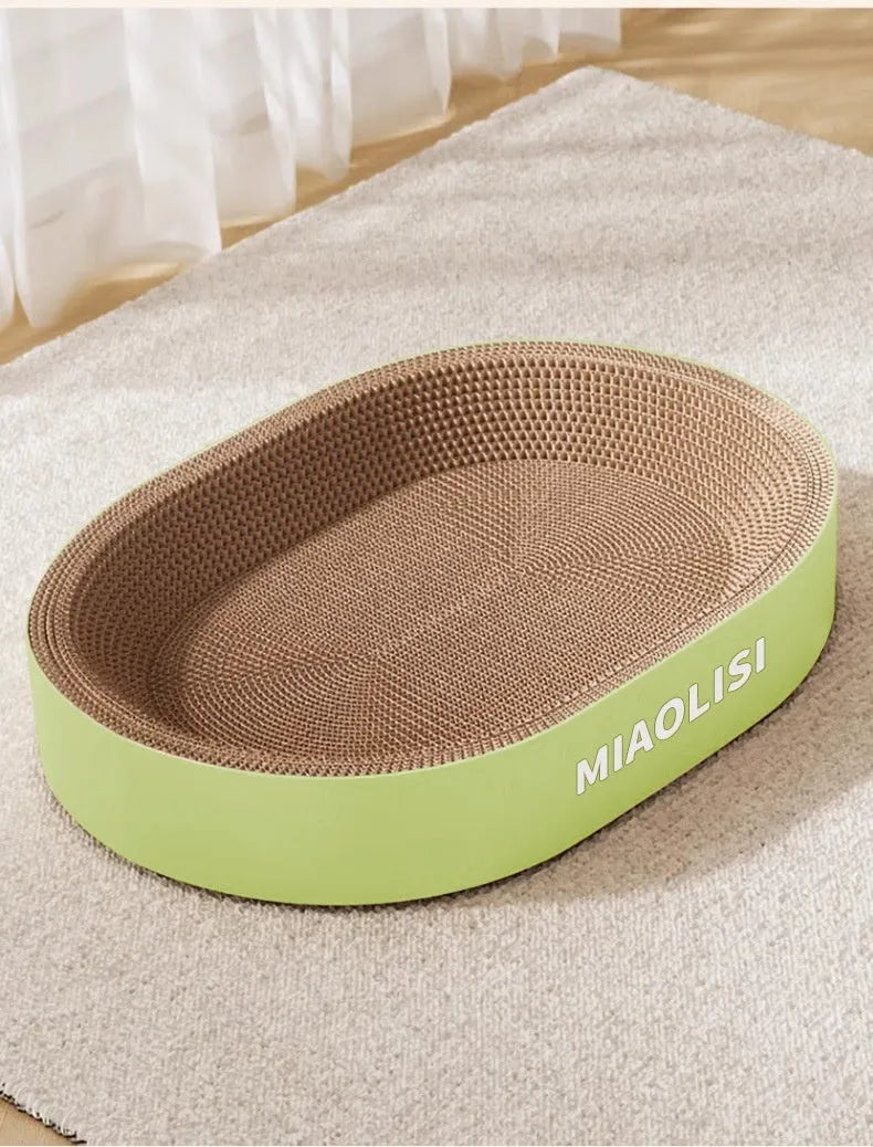 Green oval corrugated paper cat scratch board and nest measuring 55 cm in diameter