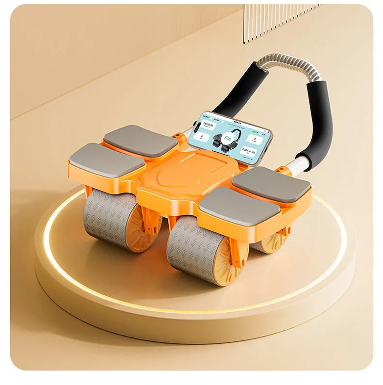 Black abdominal wheel with four wheels and automatic rebound mechanism on a floor.