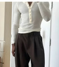 Men's cream apricot ribbed henley top with long sleeves and button placket