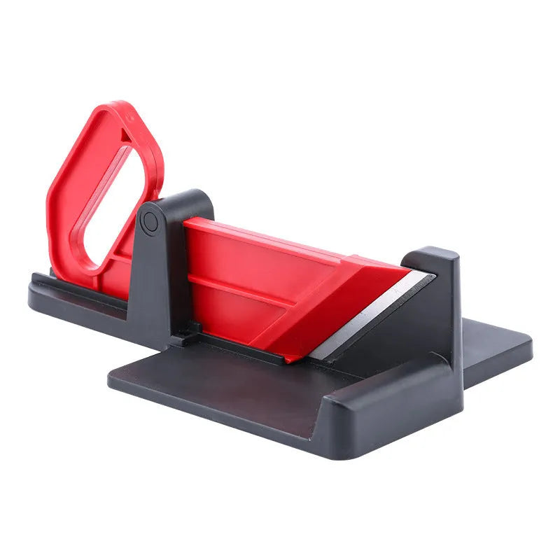 Green and red modern vegetable cutting tool for carrots and potatoes on a kitchen counter