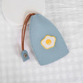 Cartoon pull-out key case in PU leather with colourful design, showing compact 14cm by 7.5cm dimensions
