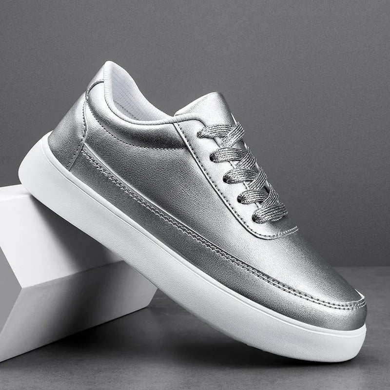 Women's white leather flat casual lace-up shoes on a neutral background.