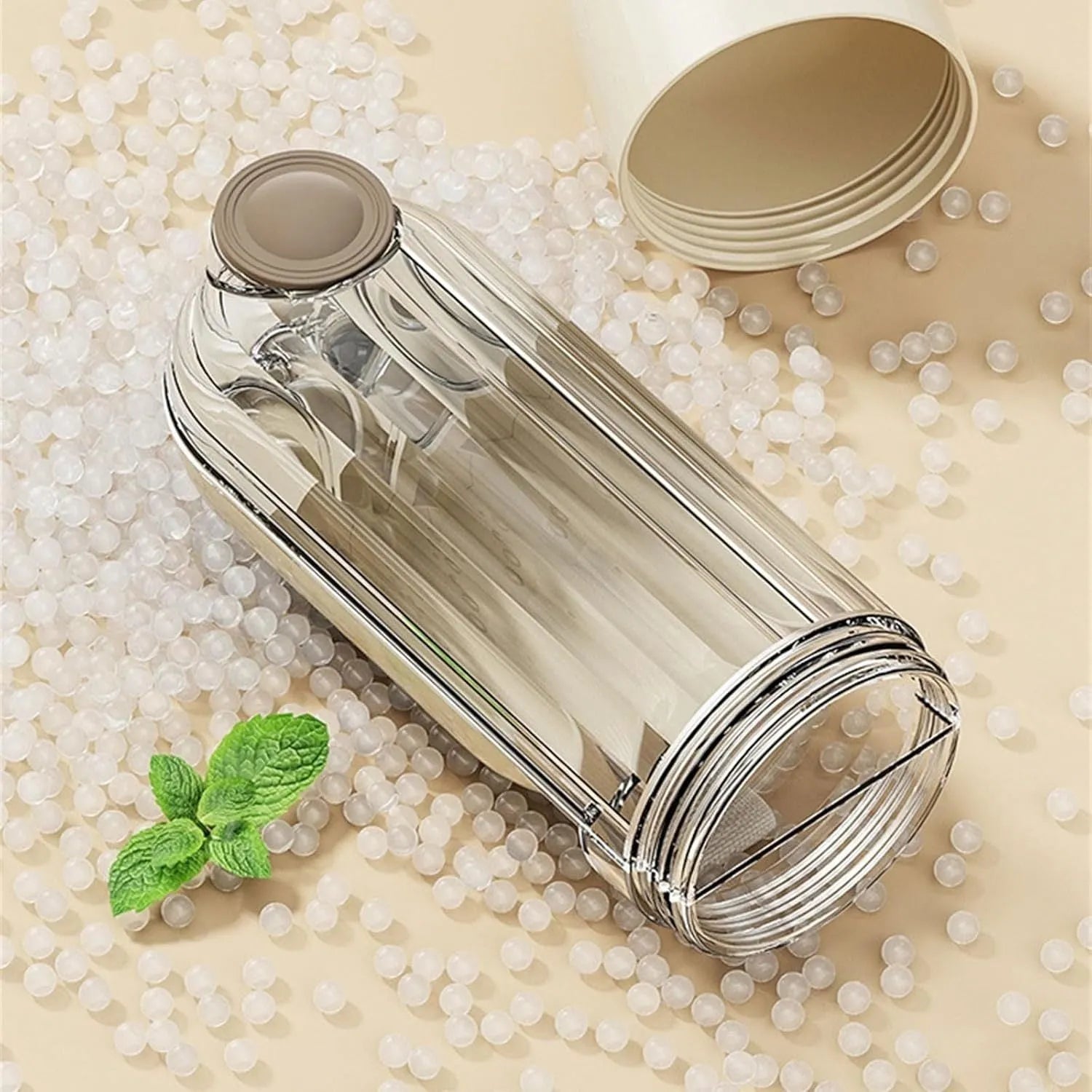 Beige and green foldable dog water bottle with food dispenser for outdoor use
