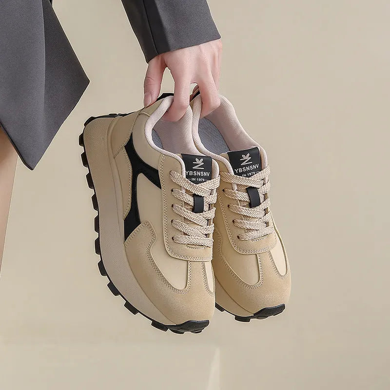 Women's low-top platform sports shoes in solid colours with lace-up front and mesh lining.