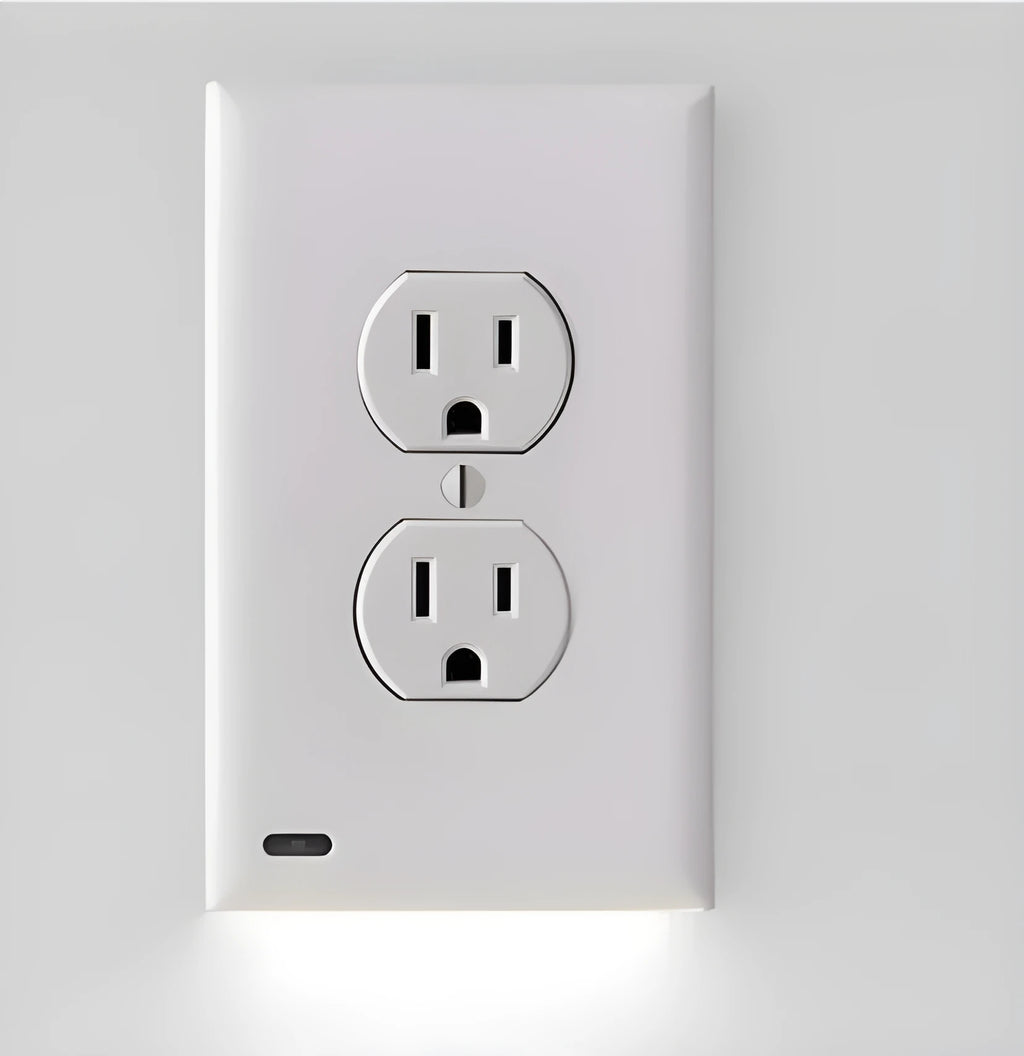 White plug-in LED night light with sensor, installed covering a wall electrical socket.
