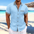 Man wearing a slim fit striped short sleeve cotton shirt with a double button front closure.