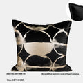 Black and gold abstract patterned decorative cushion on a sofa, available in three sizes with a removable cover.
