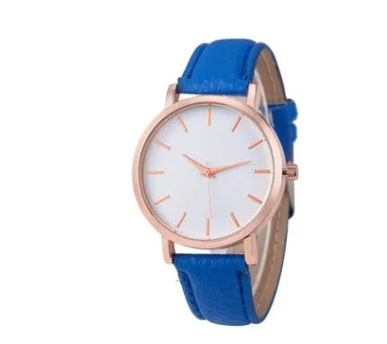 Square-faced quartz watch with an alloy case and PU leather strap on a wrist.
