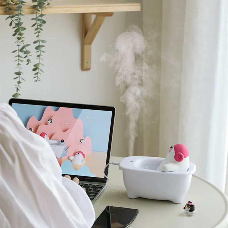 White polar bear-shaped USB air humidifier with water tank on a desk.