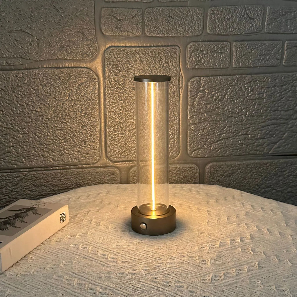 Modern glass and metal LED line light strip with magnetic back for USB-charged night lighting