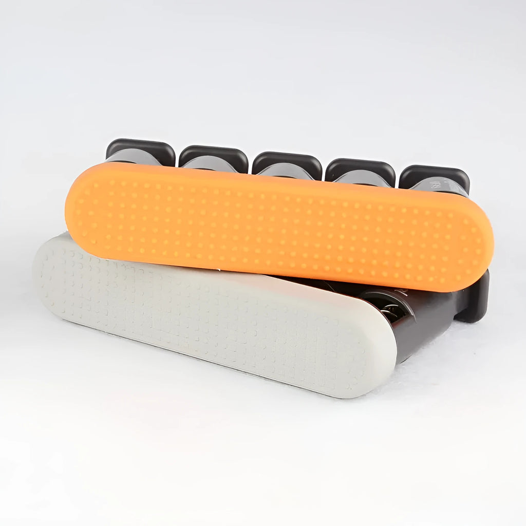 Grey and orange non-slip silicone finger trainer for guzheng, piano, and guitar practice.
