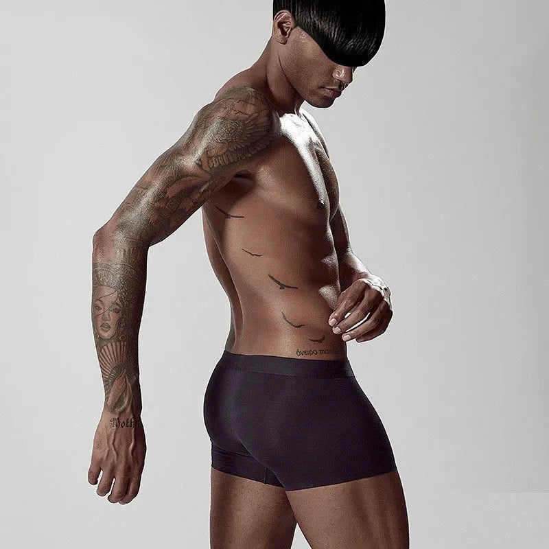 Seamless modal men's underwear in green, pink, and white colours with mid-waist design