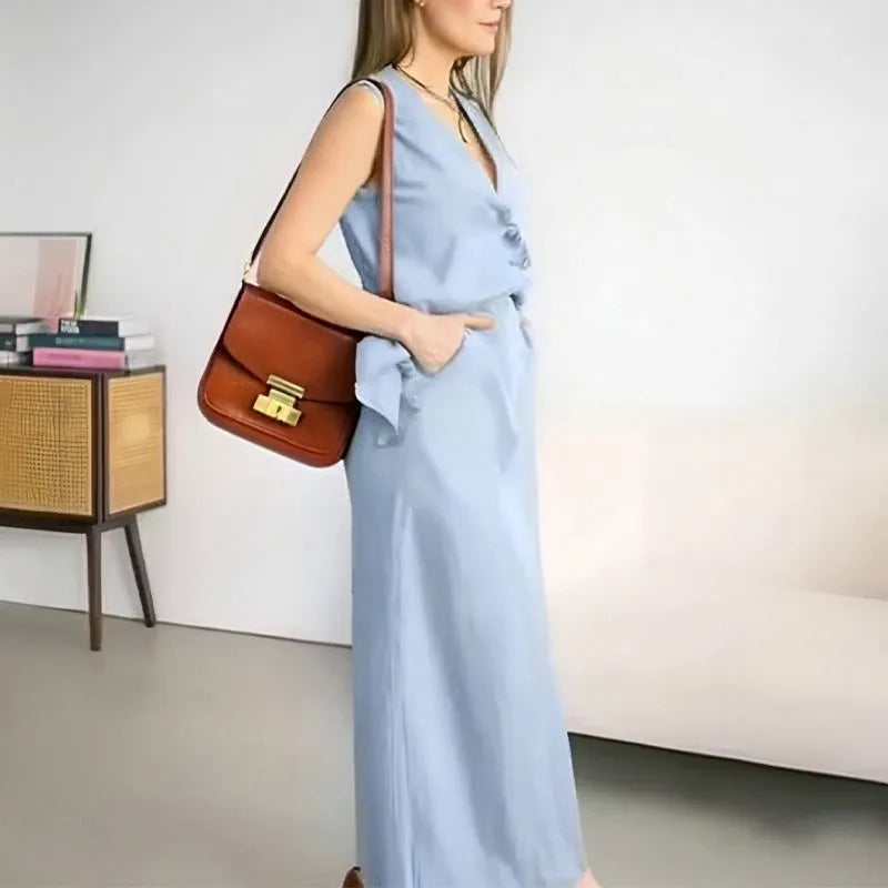Blue women's two-piece lounge set with sleeveless top and long skirt on a hanger