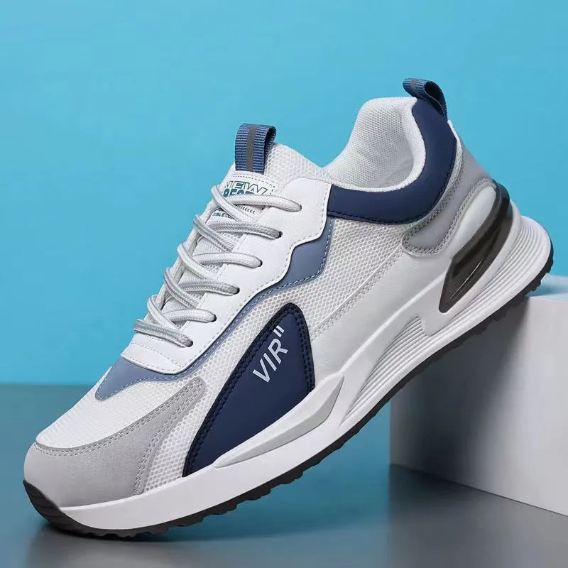 Men's colour block mesh running sneakers in black, grey, and white on a plain background.