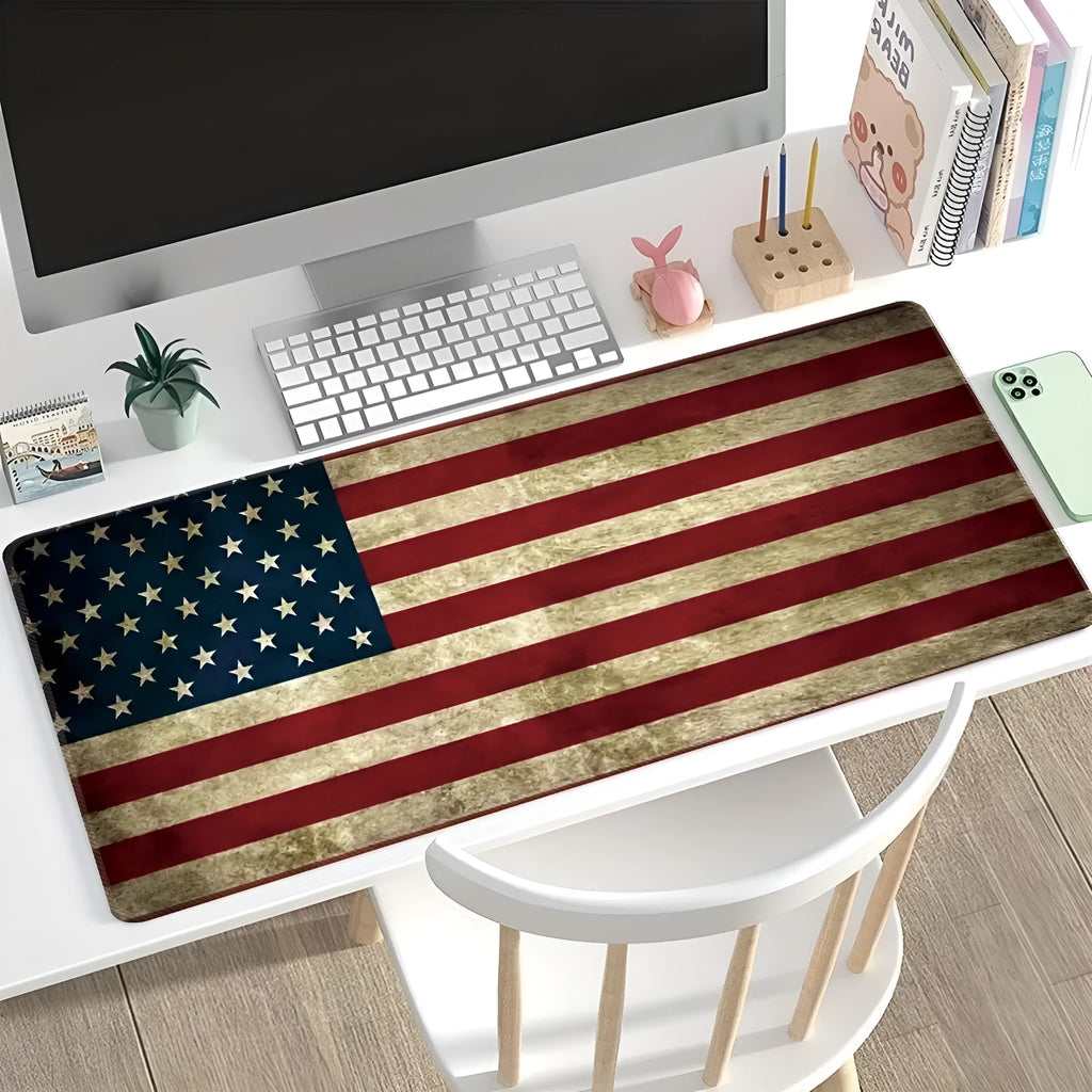 Large printed desk mat with natural rubber non-slip base on a wooden desk with keyboard and mouse.