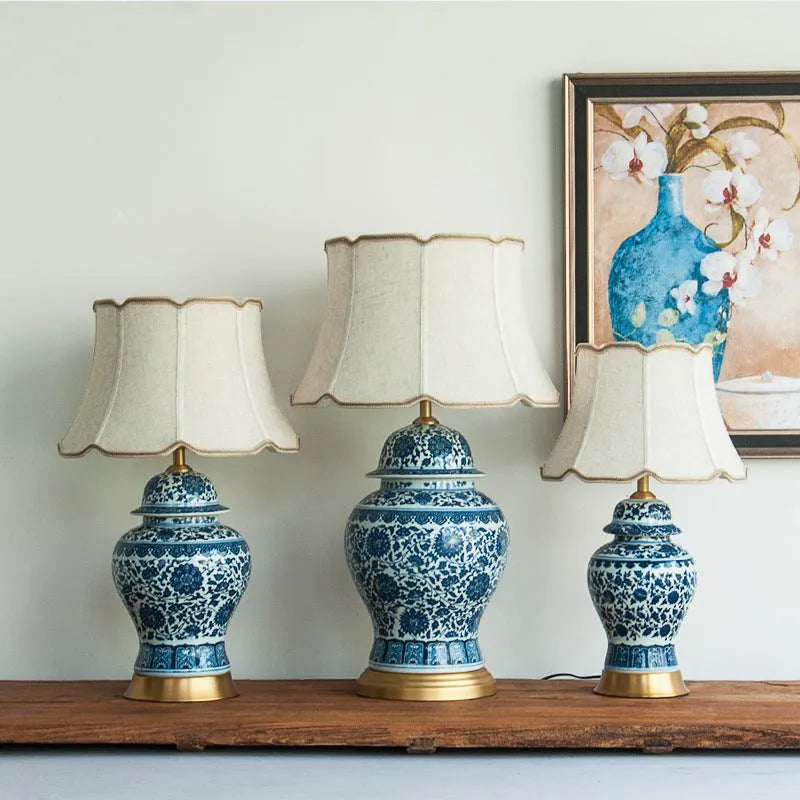 Chinese blue and white porcelain table lamp with copper base and cloth shade