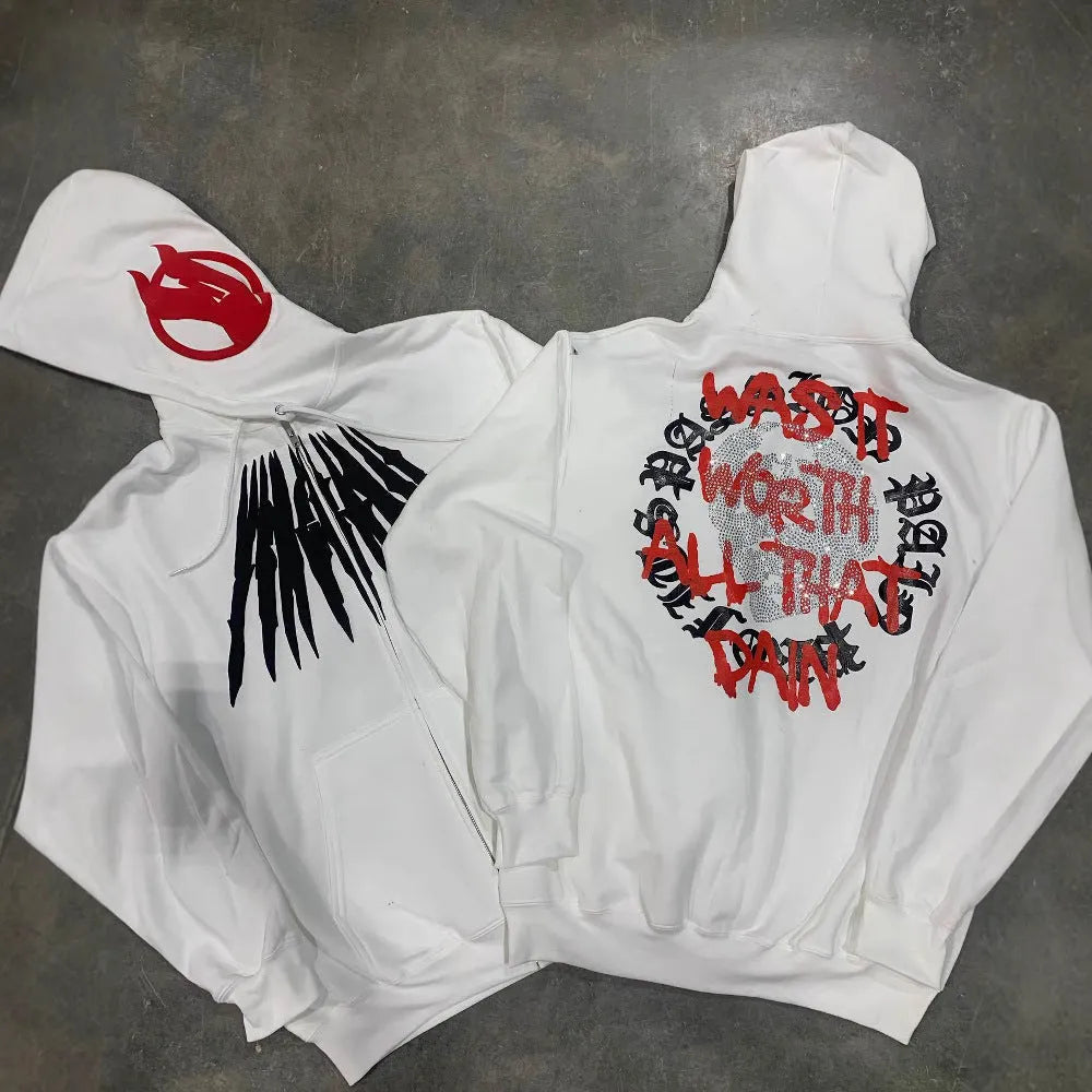 Black loose hooded cardigan sweatshirt with white skull and rhinestone print, long sleeves.