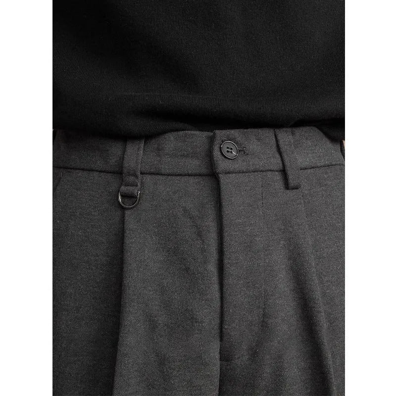 Men's straight leg casual business trousers in black, shown in a light business style setting.