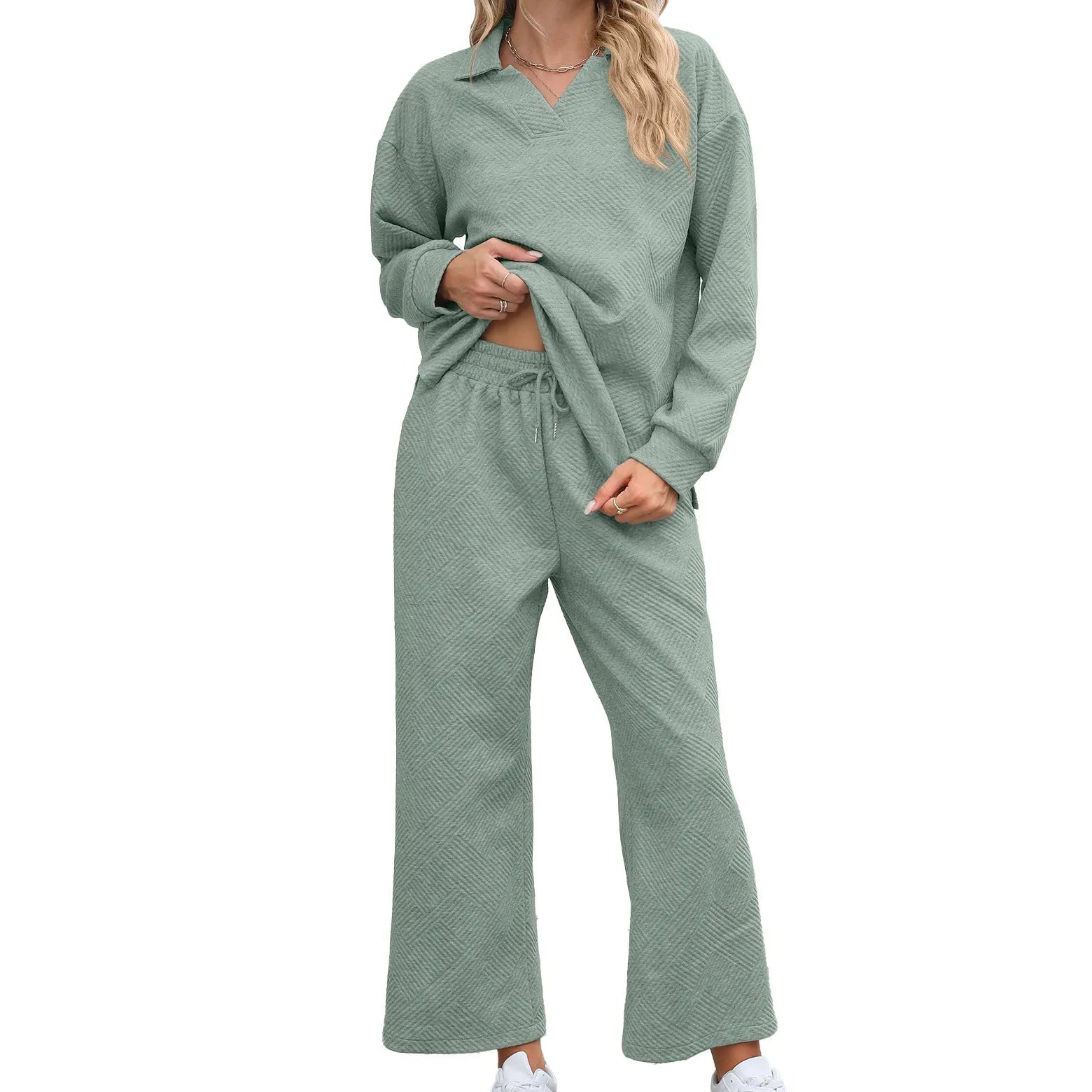 Women's solid colour lapel long sleeve knit jumpsuit with elastic waist trousers in jacquard fabric.