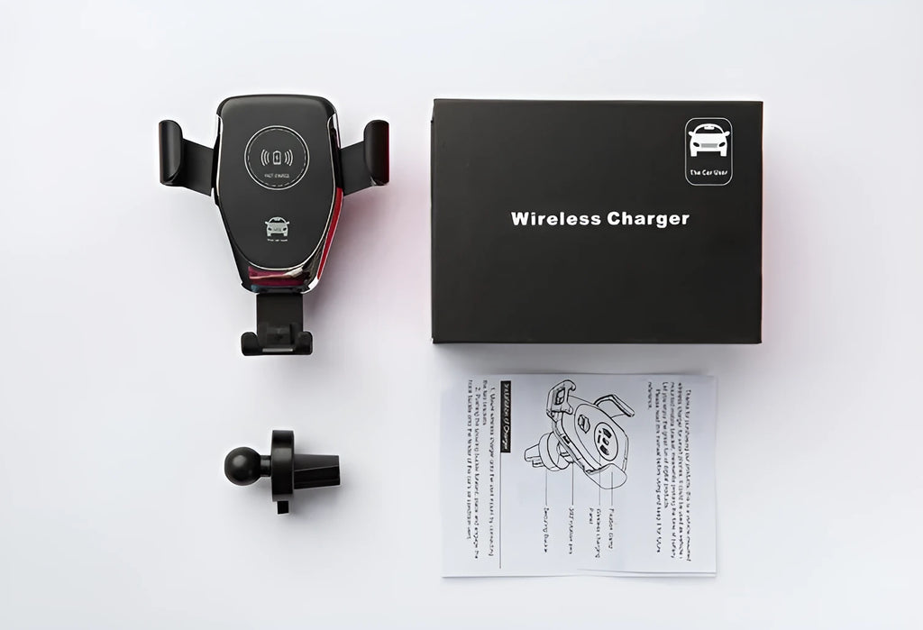 Black Qi wireless car phone mount holding an iPhone, showing automatic clamping arms and a vent clip installation.