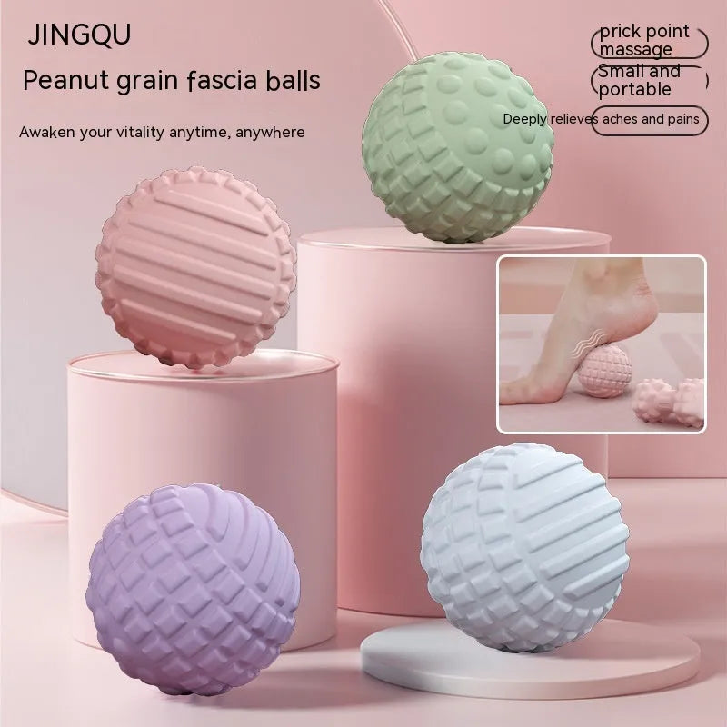 Blue TPR foot massage ball with spiky texture on wooden surface