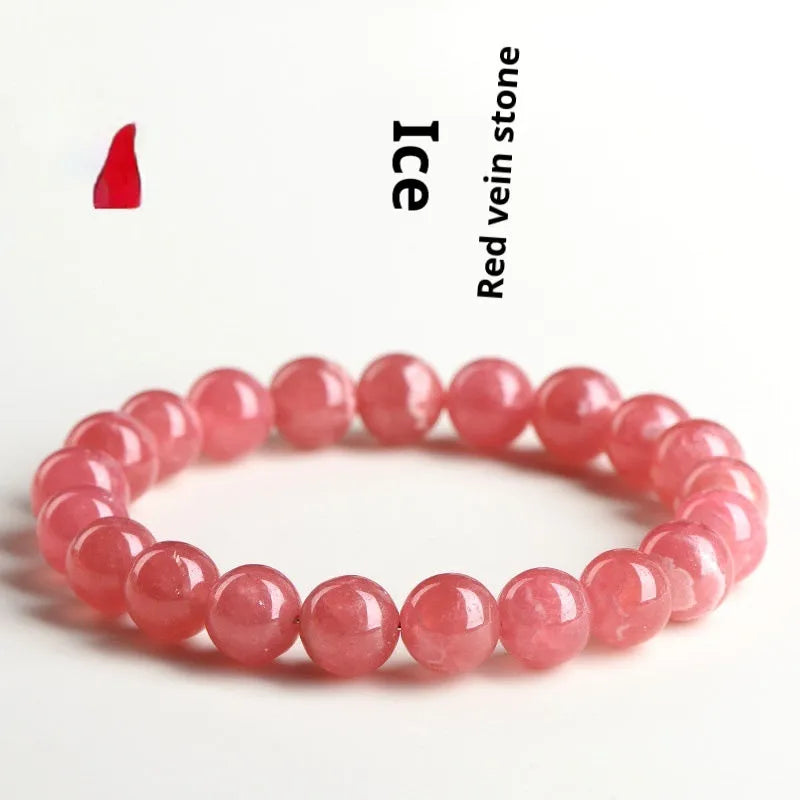 Women's geometric crystal bracelet with a red rhodochrosite stone and silver longevity lock clasp.