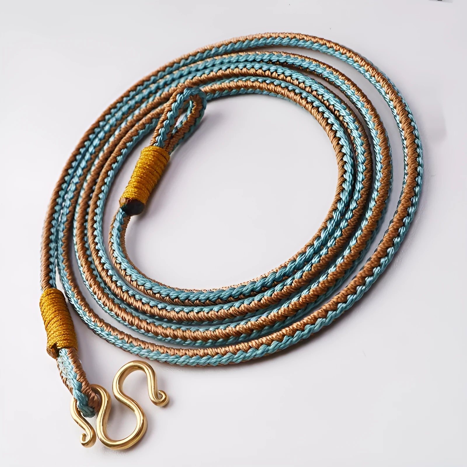 Gold and silver Thangka Peace Buckle jewellery with gem inlaid pendant on imitation pearl, showing pull ring.