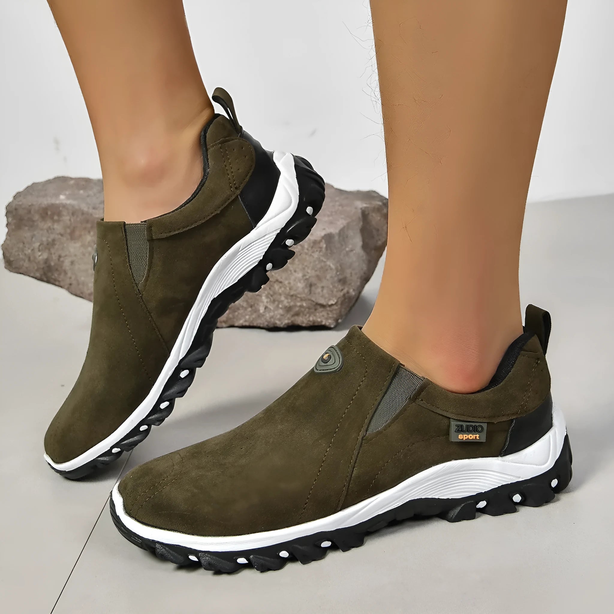 Men's grey PU slip-on overshoes with a round toe and rubber sole, shown on a foot.