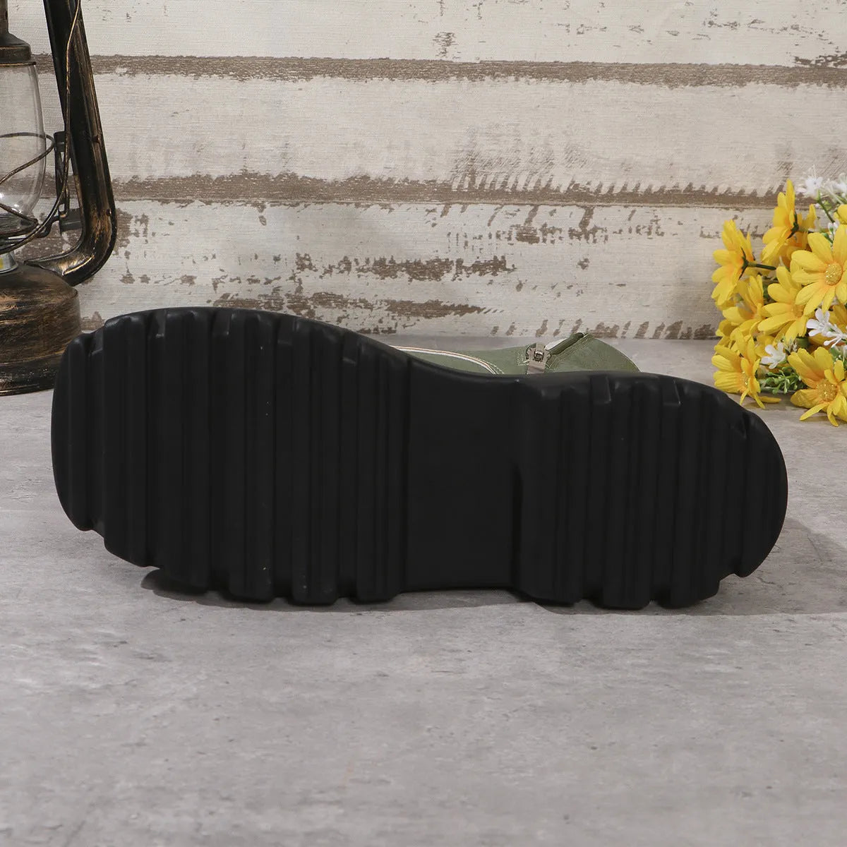 Women's black patchwork platform Martin boots with a chunky heel and side zipper.