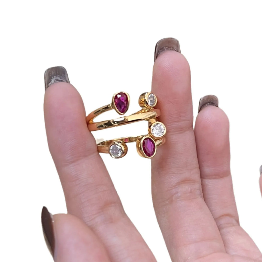 Double-headed irregular cross diamond ring in two-tone colours on a copper base.