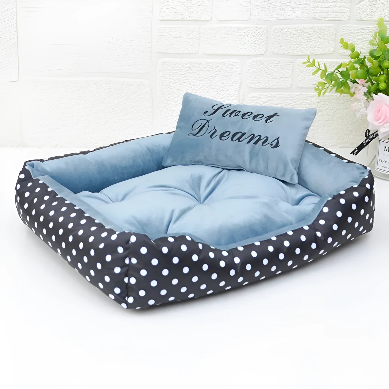 Square polka dot print dog bed with raised sides and a matching embroidery pillow for small dogs.