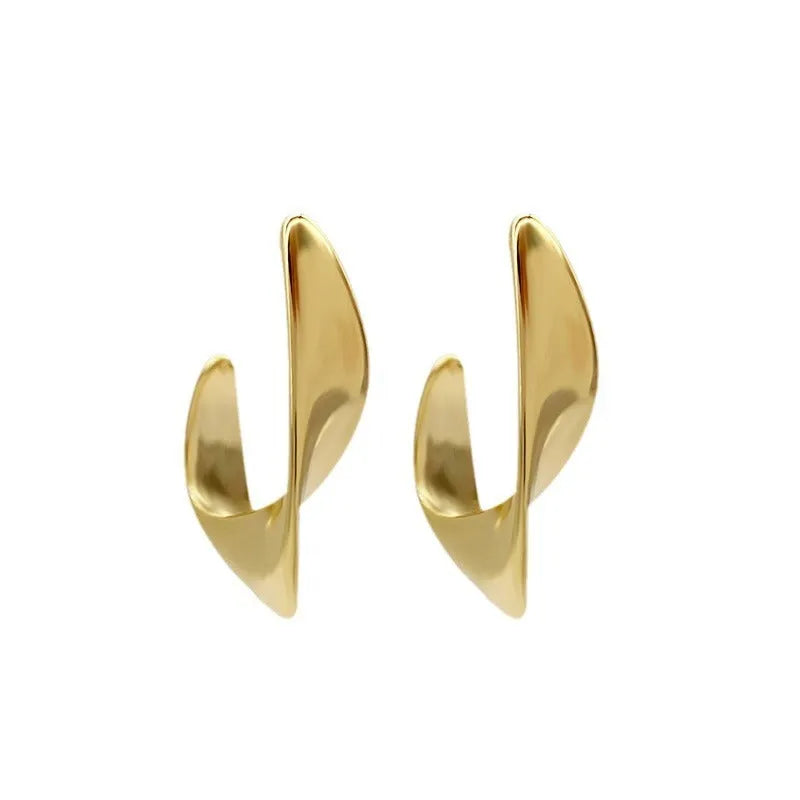 Gold and silver twisted geometric metal earrings with round shape and electroplated finish