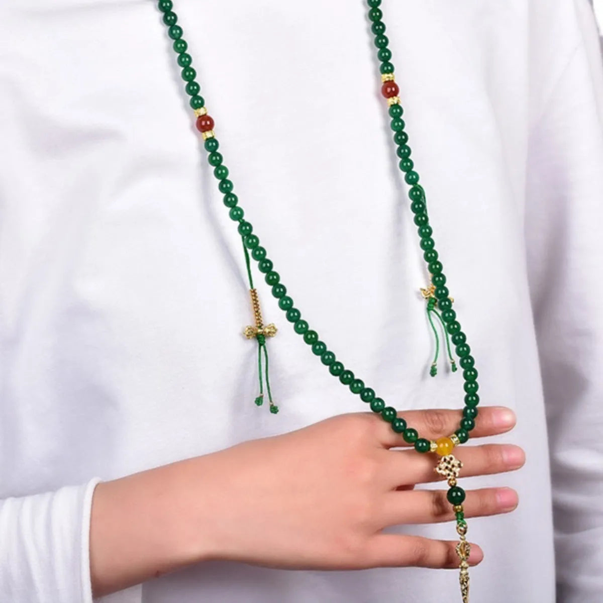Handmade green agate multi-strand bracelet for men and women on a white background.