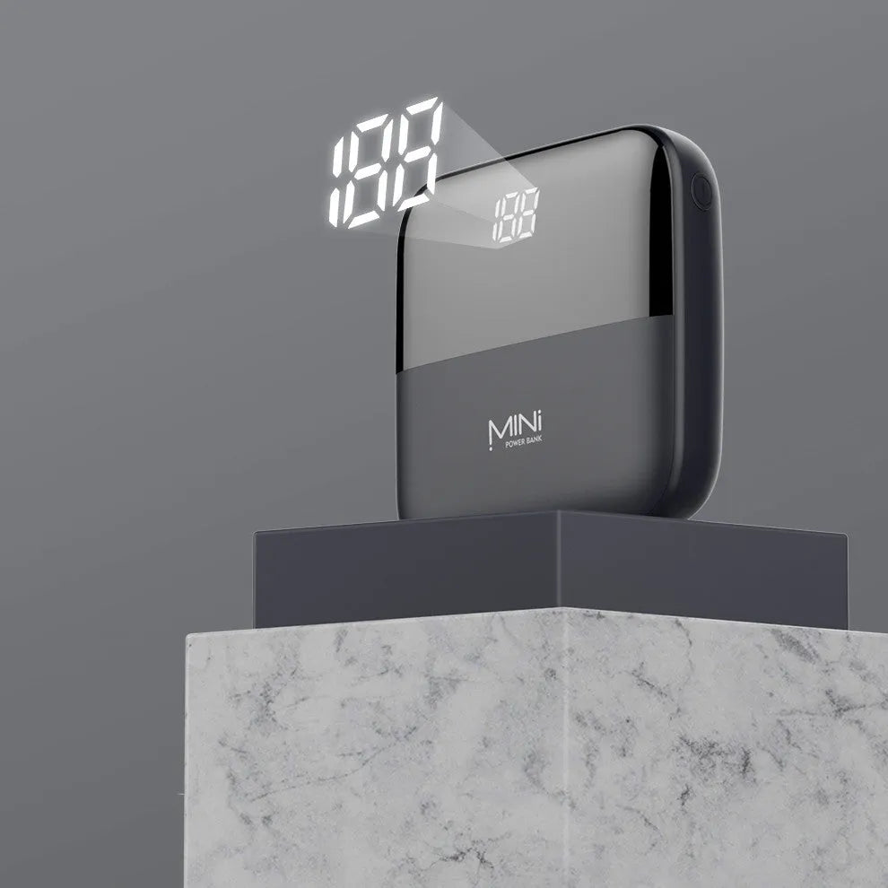 10000mAh portable power bank with digital display showing battery percentage and dual USB ports