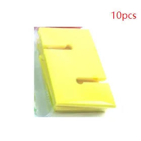 Set of coloured ABS plastic tower blocks with pull ropes and metal hook frame for outdoor team building games.