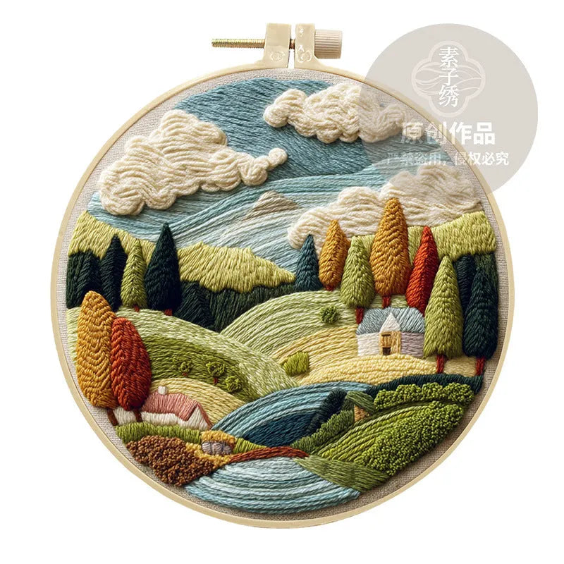 Embroidery kit with cotton fabric, bamboo frame, threads, and printed landscape design for DIY textile art