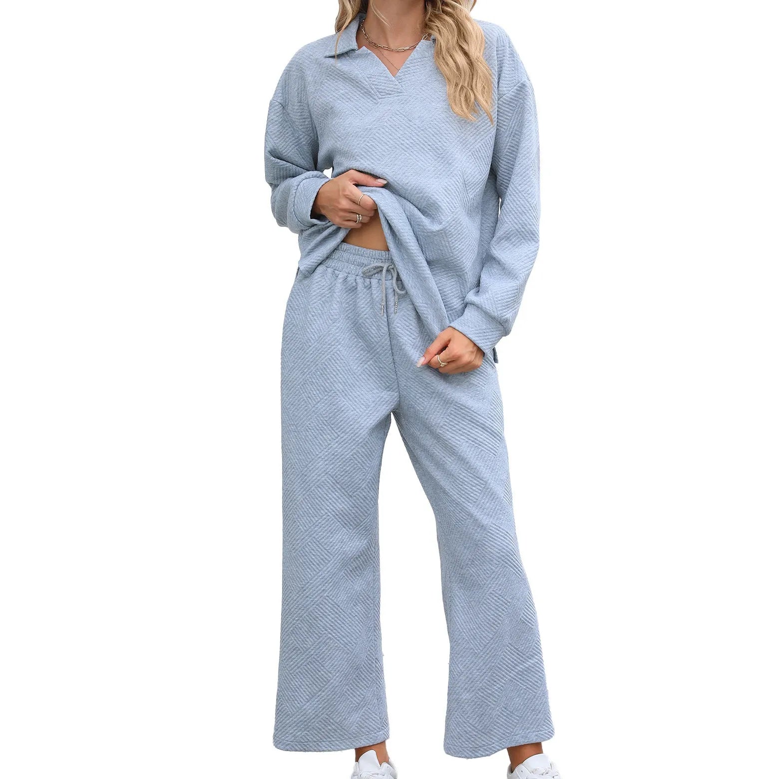 Women's solid colour lapel long sleeve knit jumpsuit with elastic waist trousers in jacquard fabric.