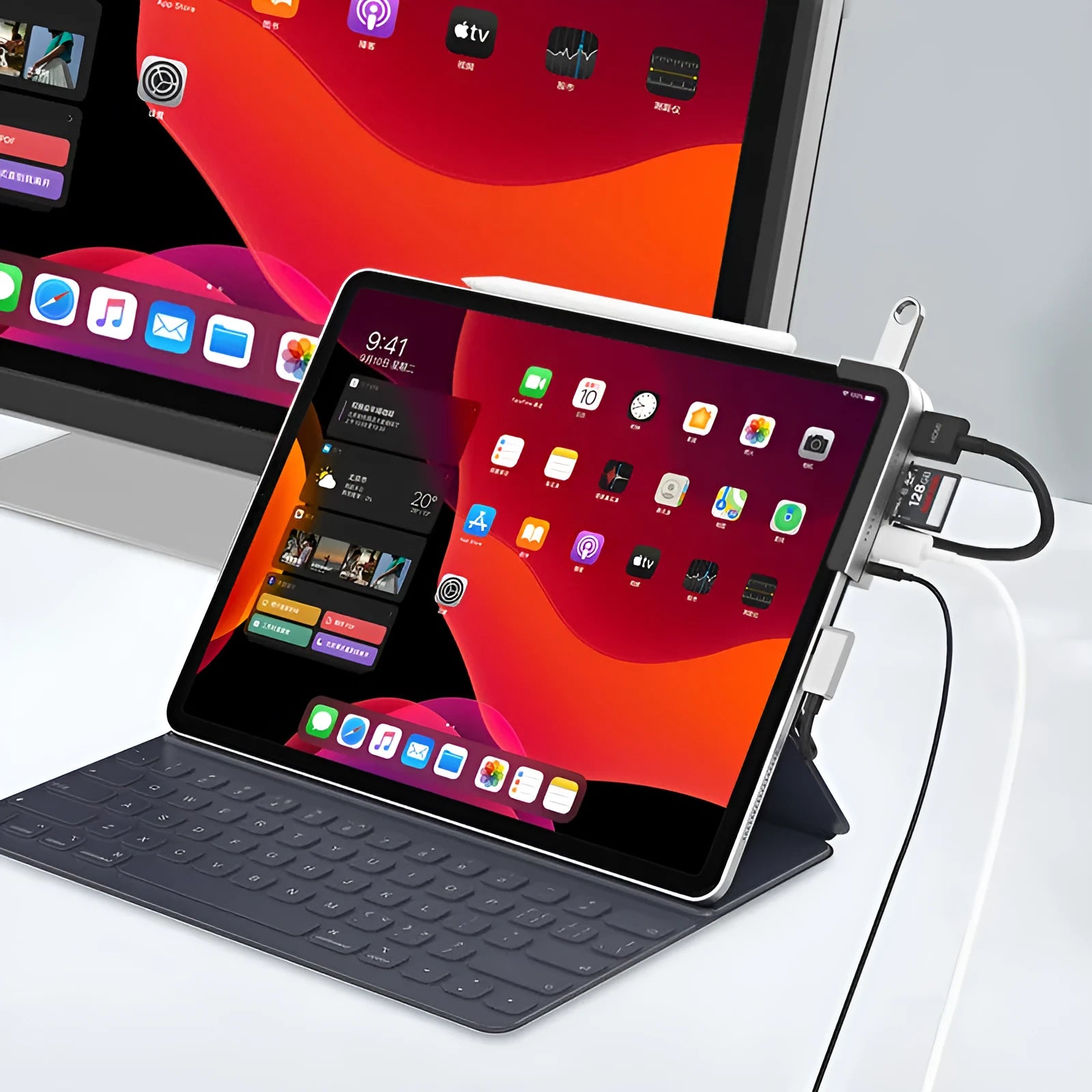 Silver aluminium grey 6-in-1 USB-C docking station for iPad Pro, shown next to a tablet.